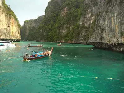 Top 10 scenic day trips from Phuket : Thai long boats on a bay in PhiPhi islands