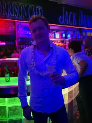 What is the Tahitian flower tradition? : Wearing a traditional Tahitian flower necklace at a club in Papeete French Polynesia